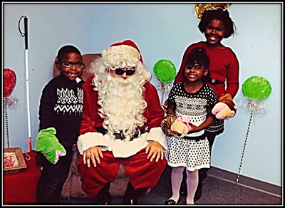 Santa and a family at BSS